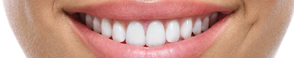 How Did the “Smile” Become a Friendly Gesture in Humans?